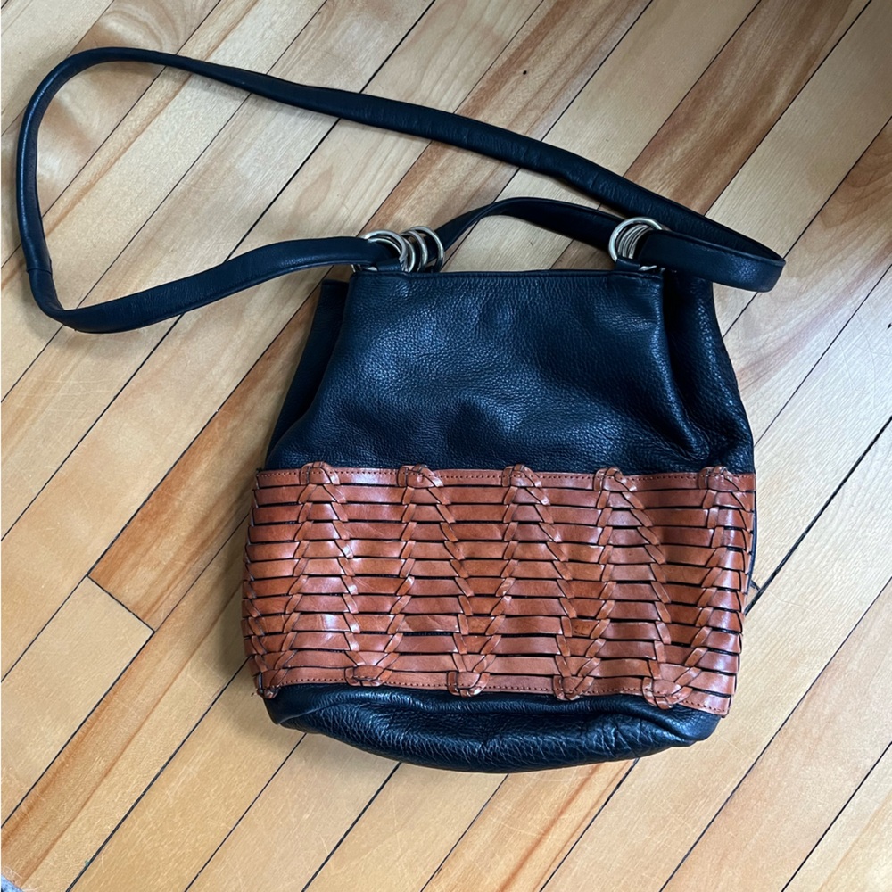 Convertible Leather Bag. Can be shoulder or bucket messenger style.